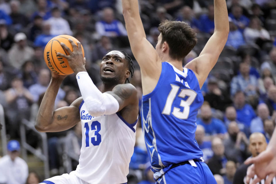 Seton Hall forward KC Ndefo, left, goes to the basket against Seton Hall forward KC Ndefo during the second half of an NCAA college basketball game, Wednesday, Feb. 8, 2023, in Newark, N.J. Creighton won 75-62. (AP Photo/Mary Altaffer)