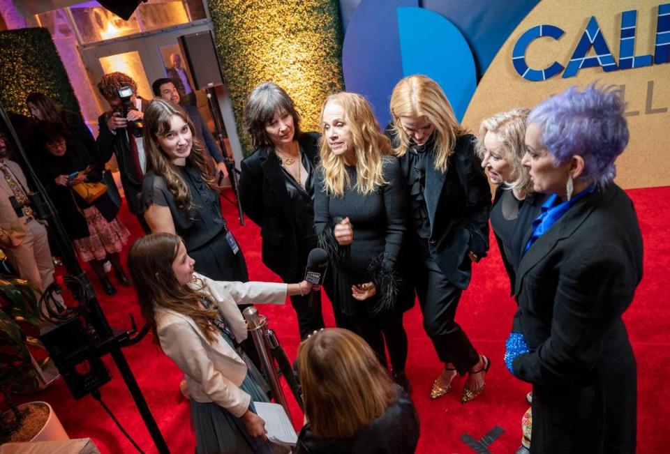 Members of the all-female pop punk band the Go-Go’s talk with a student media team from Elk Grove on the red carpet as inductees of the California Hall of Fame on Tuesday, Feb. 6, 2024, in Sacramento. Lezlie Sterling/lsterling@sacbee.com