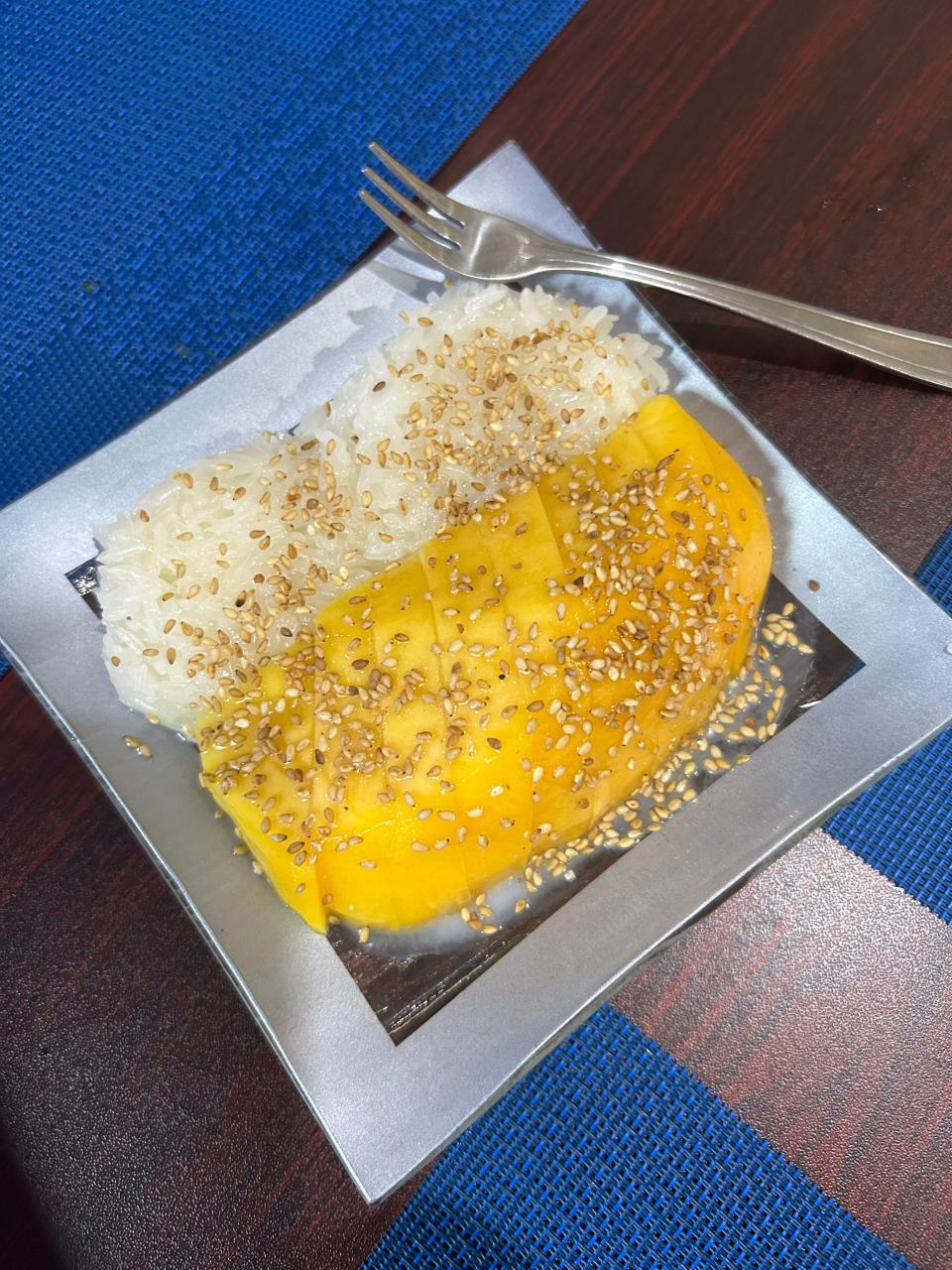 Mango sticky rice with toasted sesame seeds is one of several desserts at Lyeh Thai in Akron.