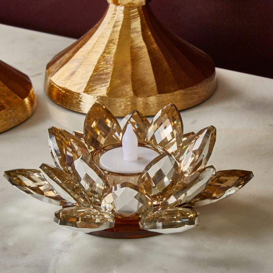 the lotus candle holder on a table