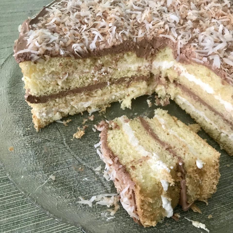 Arlene McCardle's Venetian Cocoanut Cake, which Pillsbury renamed Venetian Cream-Filled layers. It's topped with toasted coconut.