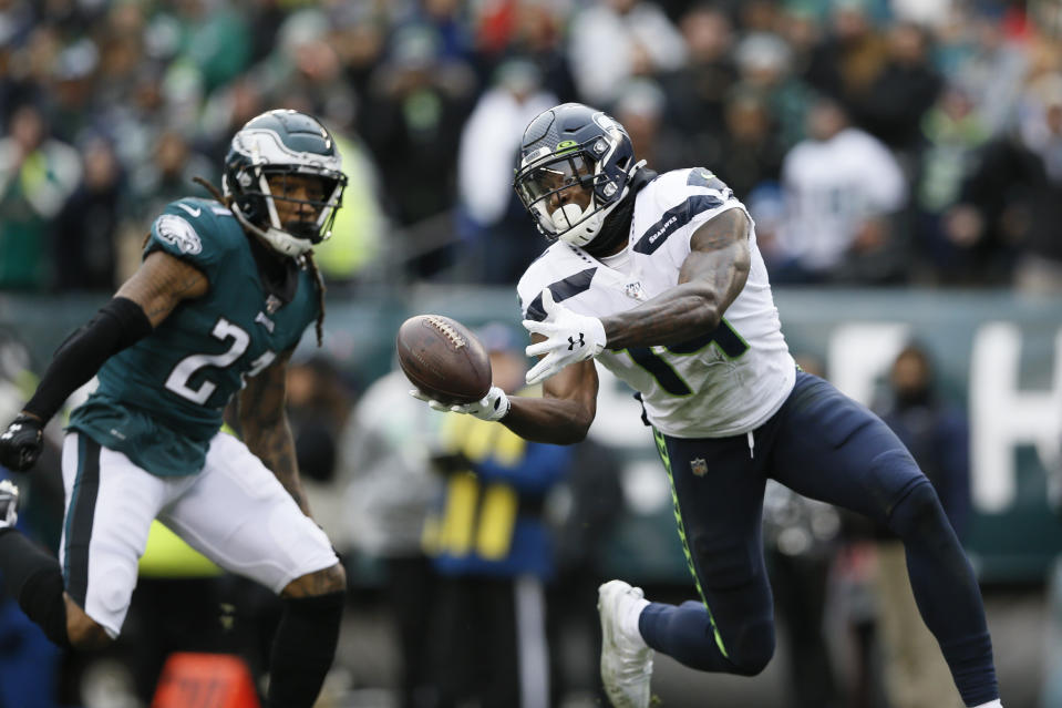 Seattle Seahawks' DK Metcalf (14) cannot hang onto a pass against Philadelphia Eagles' Ronald Darby (21) during the first half of an NFL football game, Sunday, Nov. 24, 2019, in Philadelphia. (AP Photo/Michael Perez)
