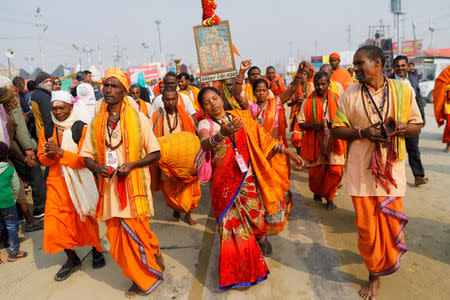 FILE PHOTO: Devotees dance during "Kumbh Mela", or the Pitcher Festival, in Prayagraj, previously known as Allahabad, India, February 2, 2019. REUTERS/Anushree Fadnavis/File Photo