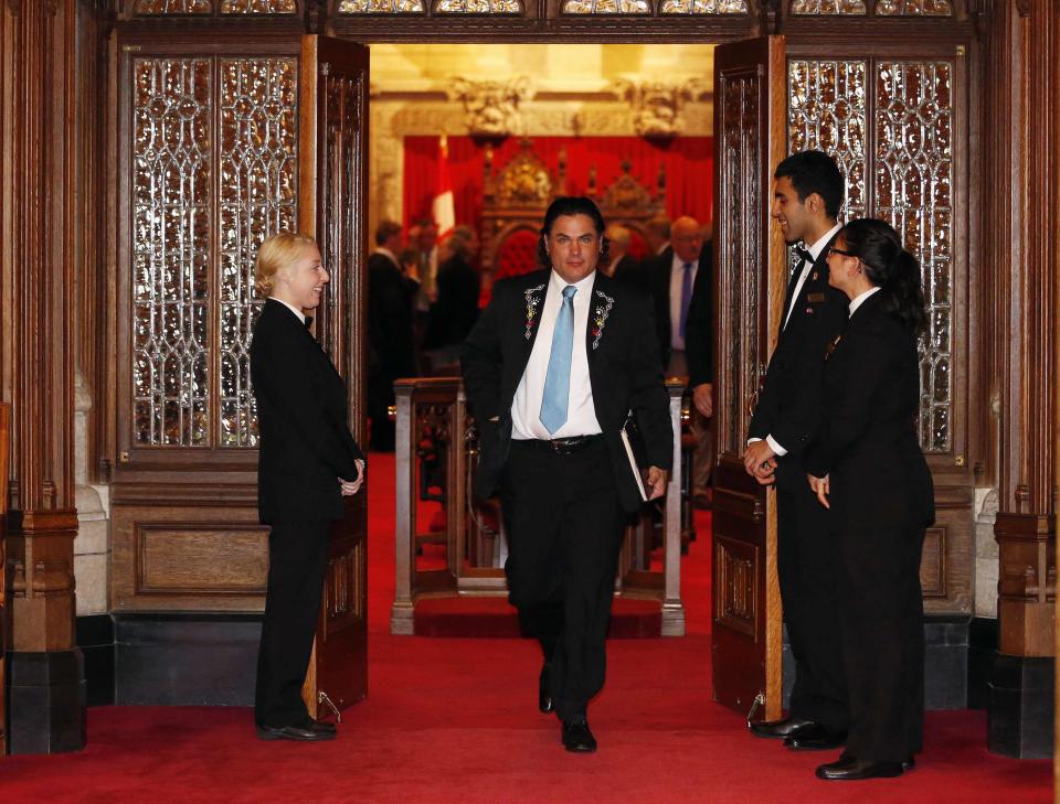 Senator Patrick Brazeau leaves the Senate chamber on Parliament Hill in Ottawa October 22, 2013. The Senate is debating whether to suspend senators Brazeau, Pamela Wallin and Mike Duffy without pay. REUTERS/Chris Wattie (CANADA - Tags: POLITICS)