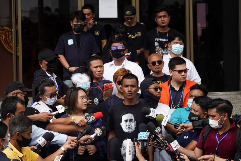 Anti-government protesters leaders Panusaya "Rung" Sithijirawattanakul, Panupong "Mike" Jadnok, and Jatupat "Pai" Boonpattararaksa arrive to report themselves over royal insult charges, at the Attorney General's office in Bangkok