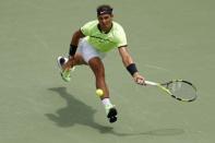 Apr 2, 2017; Key Biscayne, FL, USA; Rafael Nadal of Spain hits a forehand against Roger Federer of Switzerland (not pictured) in the men's singles championship of the 2017 Miami Open at Crandon Park Tennis Center. Mandatory Credit: Geoff Burke-USA TODAY Sports