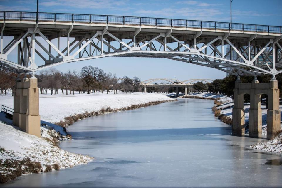 The Trinity River is mostly frozen after a snow storm Monday, Feb. 15, 2021, in Fort Worth.