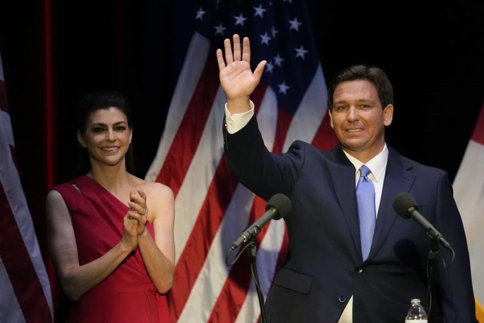 Florida’s Republican Gov. Ron DeSantis waves as his wife Casey applauds, following a televised debate against Democratic opponent Charlie Crist, in Fort Pierce, Florida, October 24, 2022. (AP Photo/Rebecca Blackwell, File)