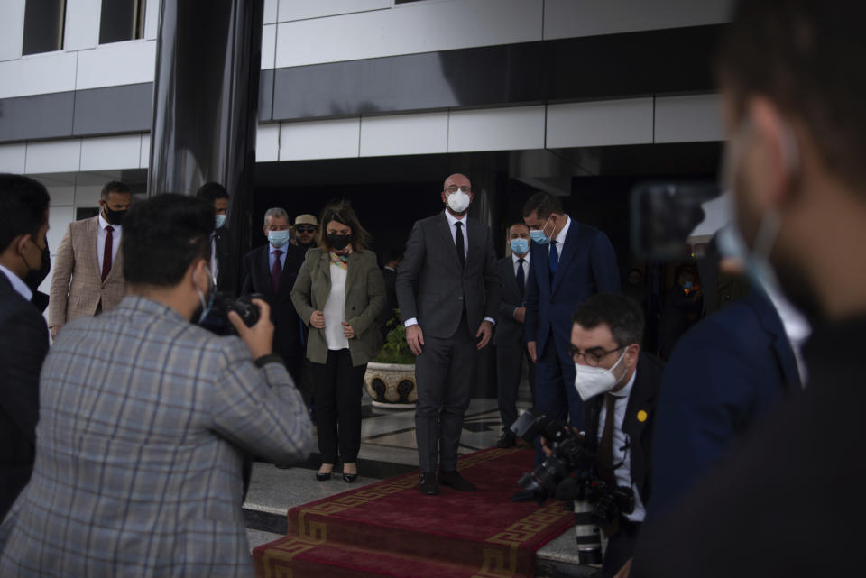 Najla Al-Manqoush, the Minister of Foreign Affairs, together with Mr. Charles Michel, the President of the European Council and the Prime Minister of the Government of National Unity, Abdul Hamid Dbeibeh, pose for a press photo at the entrance of the Prime Minister's office on Sunday, April 4, 2021, in Tripoli, Libya. (AP Photo/Nada Harib)