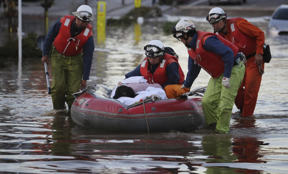 Firefighters conduct rescue operation in Motomiya City, one day after Typhoon Hagibis, a powerful super typhoon. Source: The Yomiuri Shimbun via AP Images.