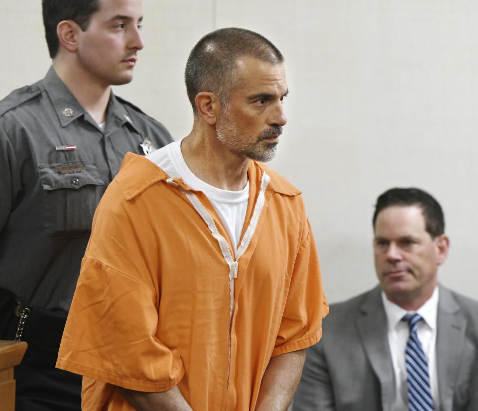 Fotis Dulos, center, is arraigned on charges of tampering with or fabricating physical evidence and first-degree hindering prosecution at Norwalk Superior Court in Norwalk, Conn. Monday, June 3, 2019. Fotis Dulos and his girlfriend, Michelle C. Troconis were arrested at an Avon hotel late Saturday night and held on a $500,000 bond for charges of tampering with or fabricating physical evidence and first-degree hindering prosecution. Fotis Dulos is the estranged husband of Jennifer Dulos, the 50-year-old mother of five who has been missing since May 24. (Tyler Sizemore/Hearst Connecticut Media via AP, Pool)