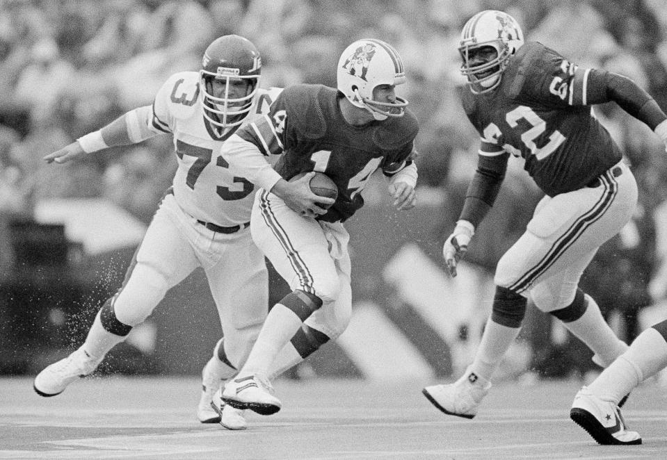 New York Jets defensive end Joe Klecko has New England Patriots quarterback Steve Grogan on the run in the first quarter at Schaefer Stadium in Foxboro, Mass., Nov. 15, 1981.