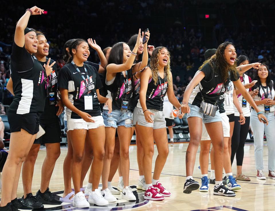 July 22, 2022;  Phoenix, Arizona; USA; NABIs Native Soldiers celebrate as they are announced on the court during halftime of a Mercury game at the Footprint Center. The team will play for the championship.