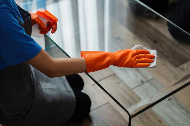 <p>Getty</p> A stock image of a person cleaning