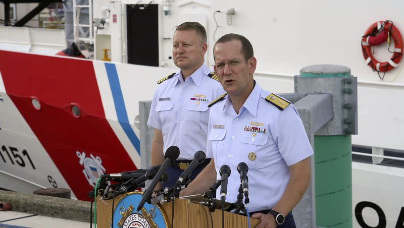 U.S. Coast Guard Rear Adm. John Mauger, commander of the First Coast Guard District, right, speaks to members of the media during a news conference, June 25, 2023, at Coast Guard Base Boston, in Boston. The U.S. Coast Guard led an investigation into the loss of the Titan submersible.