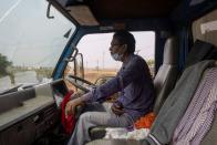 The Wider Image: The 1,700km journey to deliver coronavirus vaccine to India's rural health workers