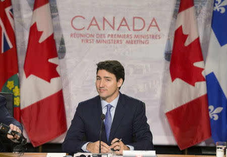 FILE PHOTO: Canadian Prime Minister Justin Trudeau addresses the premiers of the ten provinces and Indigenous Leaders in Montreal, Quebec, Canada, December 7, 2018. REUTERS/Christinne Muschi/File Photo