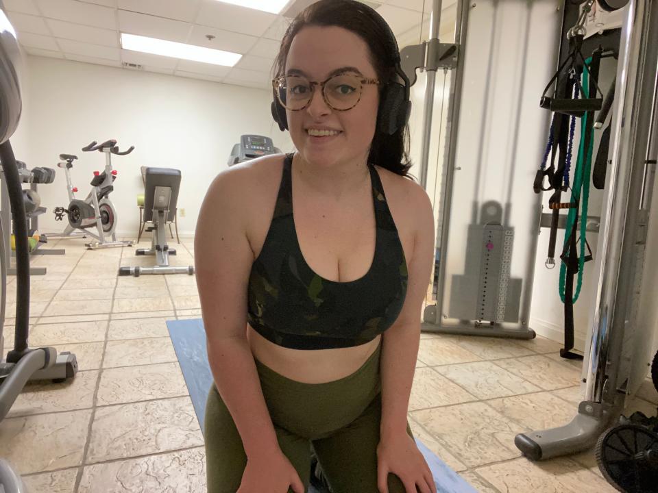 Freelancer Paige Bennett smiling in a gym.