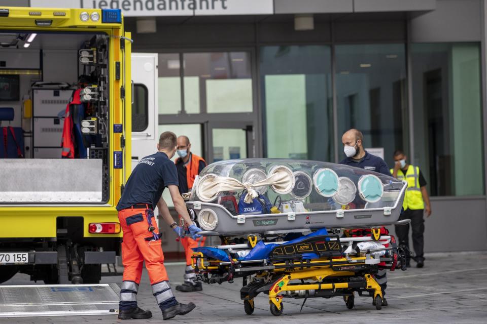 German army emergency personnel load a portable isolation unit into their ambulance that was used to transport Alexei Navalny (Getty Images)