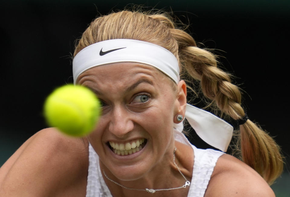 Czech Republic's Petra Kvitova returns the ball to Sloane Stephens of the US during the women's singles match on day one of the Wimbledon Tennis Championships in London, Monday June 28, 2021. (AP Photo/Kirsty Wigglesworth)