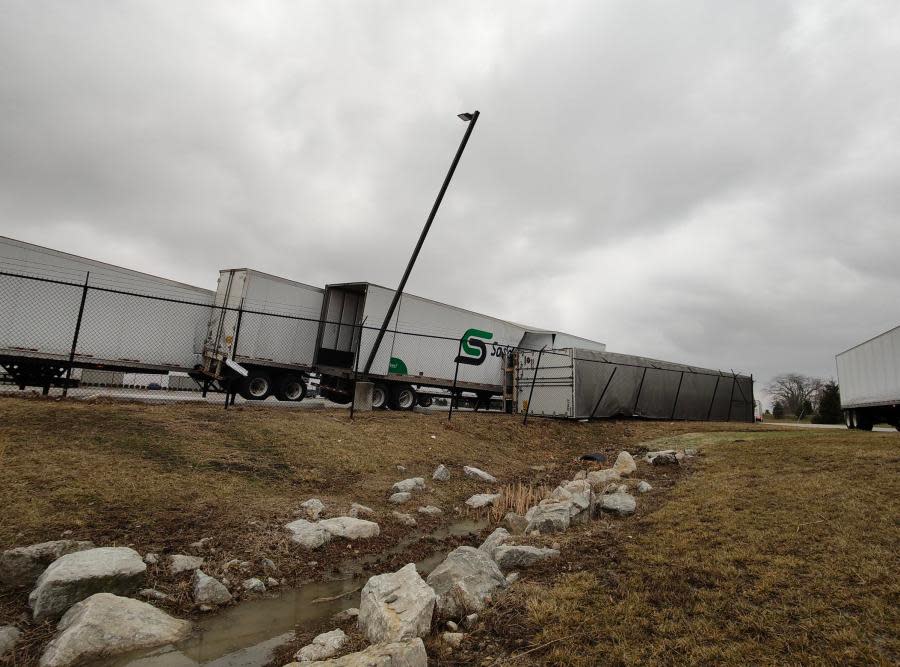 Four trailers fell against each other during Feb. 28, 2024 storms at a Groveport logistics center, overturning one and sending it smashing through the fence. (NBC4 Photo/Mark Feuerborn)
