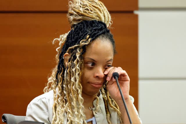 <p>Amy Beth Bennett/South Florida Sun-Sentinel via AP</p> Philana Holmes testifies at the Broward County Courthouse in Fort Lauderdale, Fl. on July 18