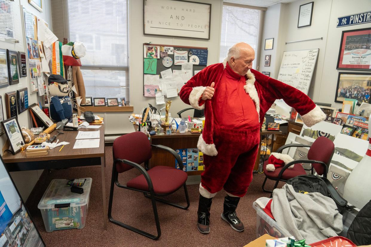 Eddie Broderick, 83 of Bayonne, has been portraying Santa Claus for the past 57 years in Bayonne, NJ. Broderick gets dressed in an office at Bayonne City Hall on December 19, 2023.