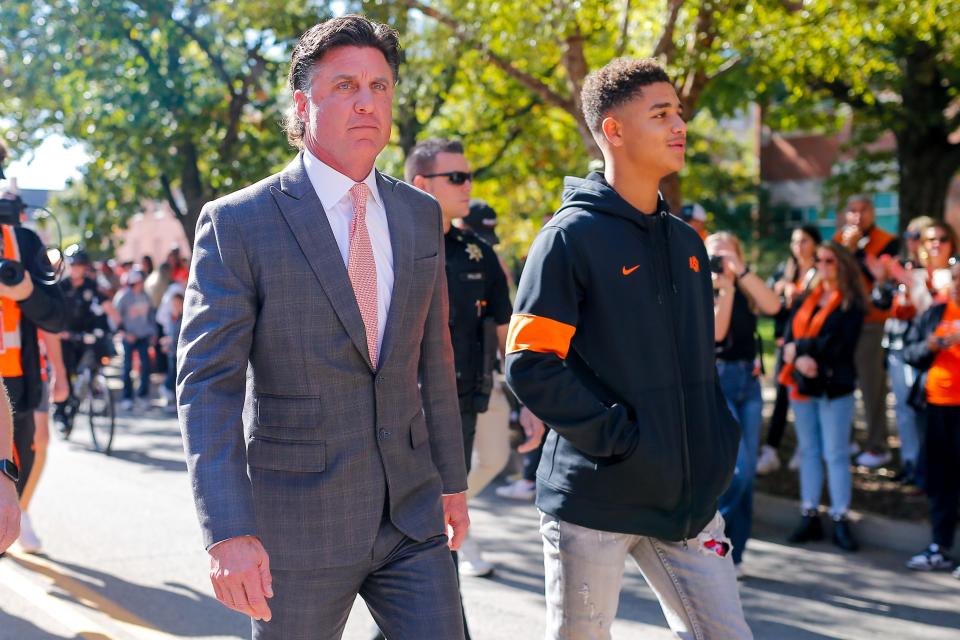 Mike Gundy walks to the stadium before a Bedlam college football game between the Oklahoma State University Cowboys (OSU) and the University of Oklahoma Sooners (OU) at Boone Pickens Stadium in Stillwater, Okla., Saturday, Nov. 4, 2023.