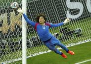 Mexico's Guillermo Ochoa jumps to save the ball during their 2014 World Cup Group A soccer match against Brazil at the Castelao arena in Fortaleza, June 17, 2014. (Mike Blake/Reuters)