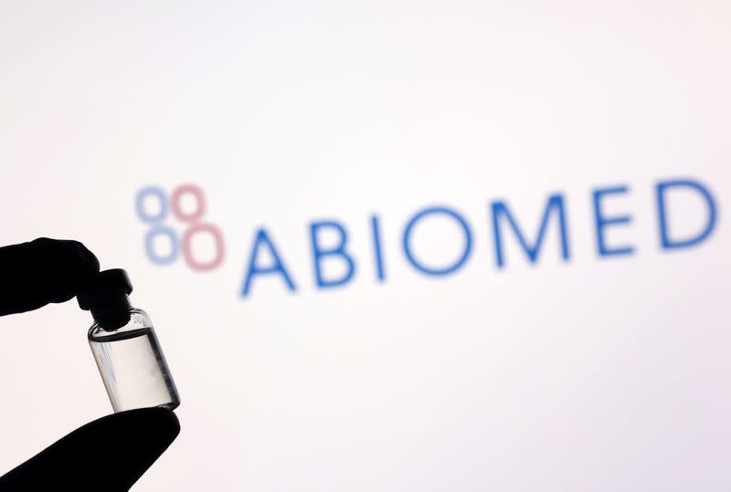 Illustration shows a vial in front of displayed Abiomed logo