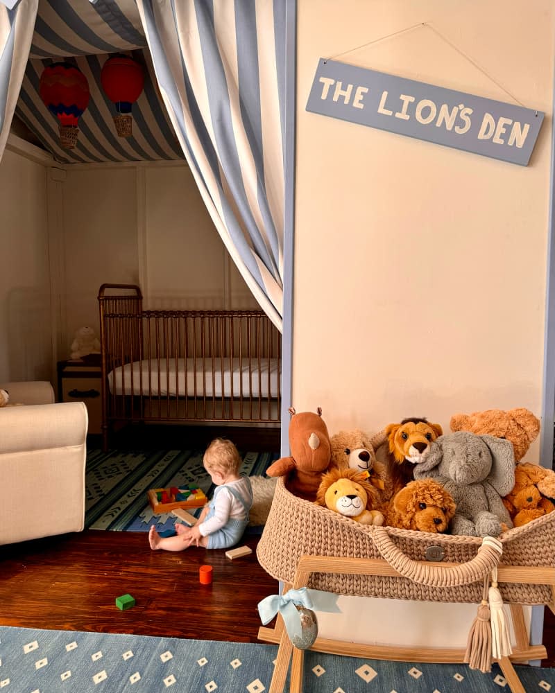 Baby playing on floor of newly remodeled nursery.