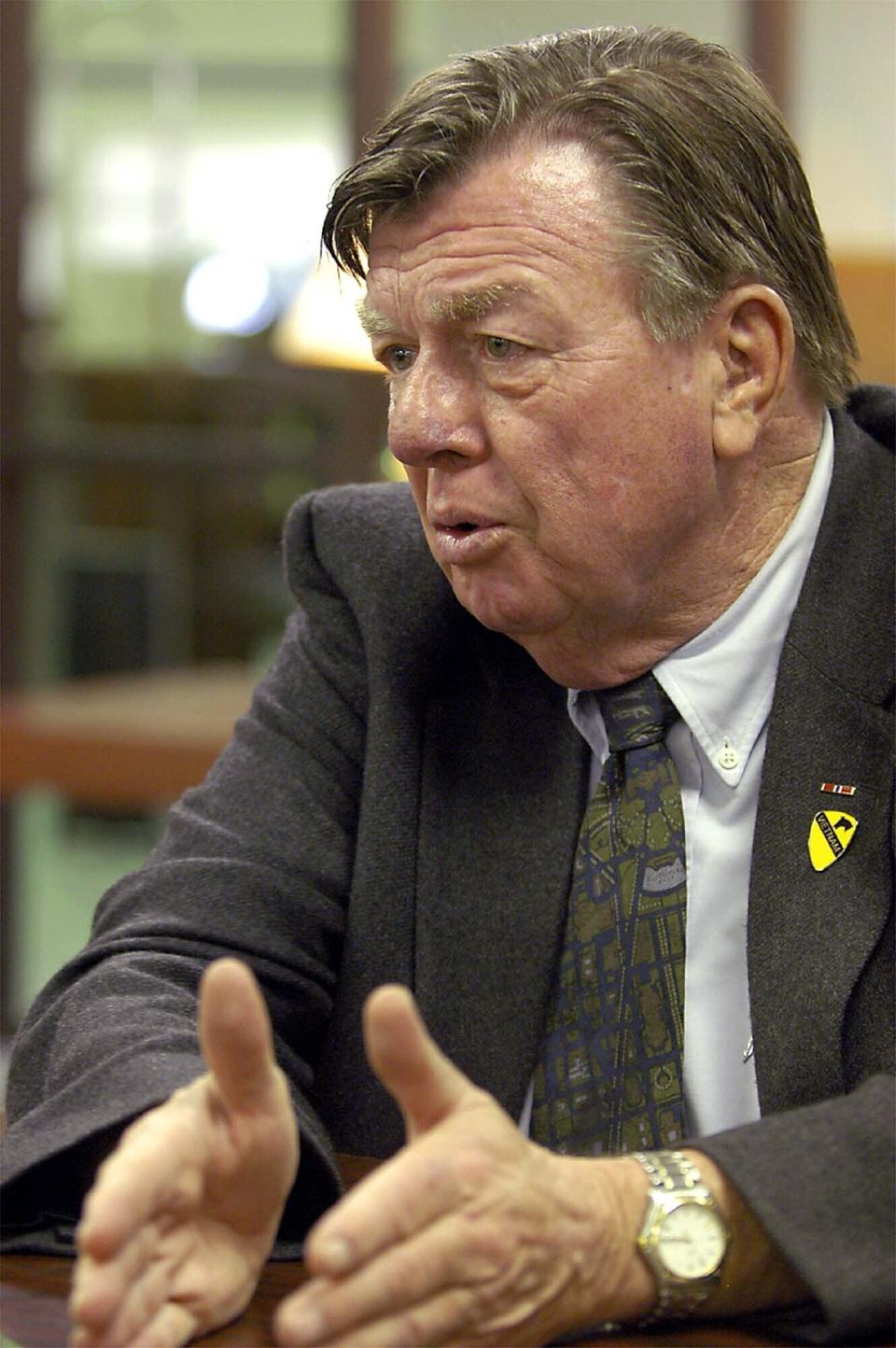 FILE- Joe Galloway, war correspondant and co-author of "We Were Soldiers Once ... and Young, speaks during an appearance at the New Mexico Military Institute in Roswell, N.M., on Feb. 6, 2004. Galloway, best known for his book recounting a pivotal battle in the Vietnam War that was made into a Hollywood movie, has died. He was 79. His wife, Grace Galloway, confirmed to AP that he died Wednesday morning after being hospitalized near their home in North Carolina. (Andrew Poertner/Roswell Daily Record via AP)