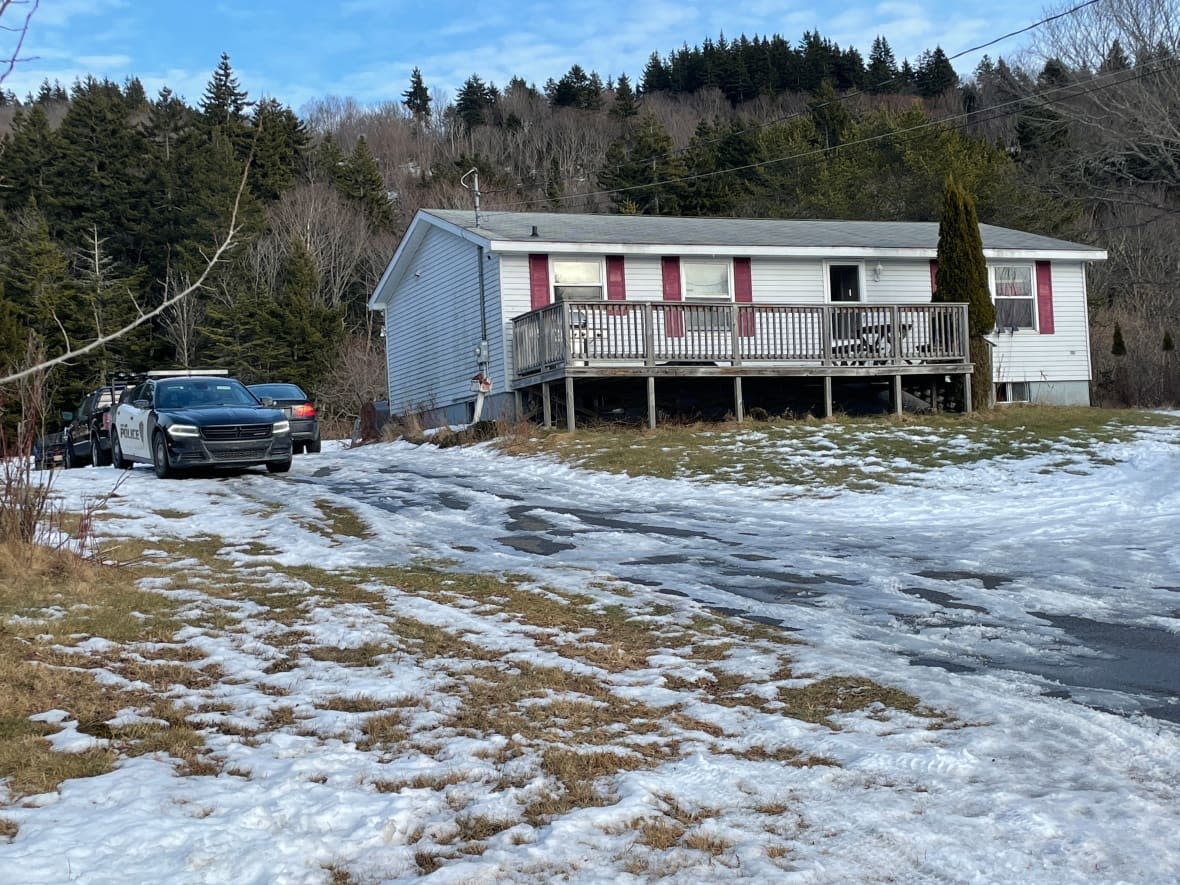 Two police cars were parked outside a home on Red Head Road in Saint John on Monday afternoon. Police would not confirm this is the home where the two people were found dead. (Graham Thompson/CBC - image credit)