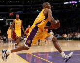 Lakers guard Kobe Bryant drives for an uncontested basket against the Cleveland Cavaliers on Jan. 13 in Los Angeles. (Photo by Stephen Dunn/Getty Images)