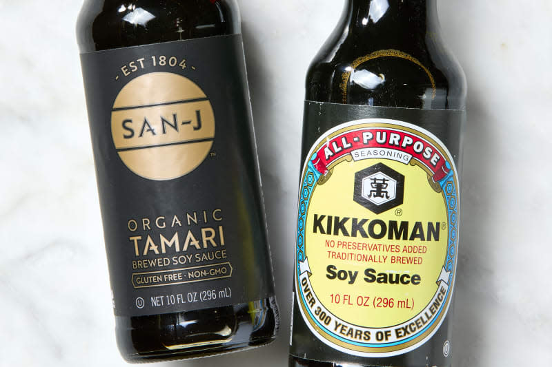 close up shot of a bottle of organic tamari on the left, and a bottle of soy sauce on the right.