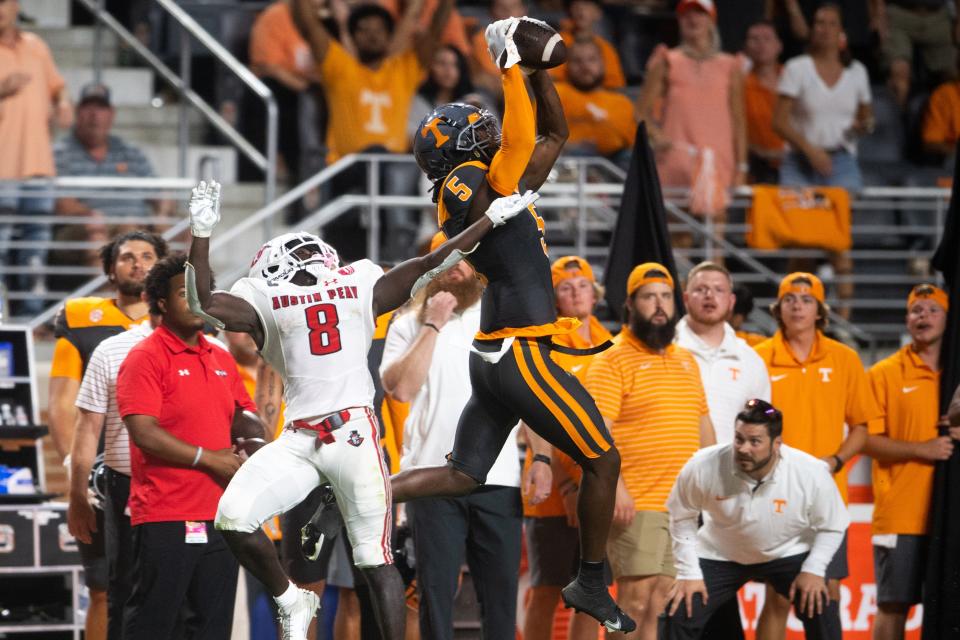 Tennessee defensive back Kamal Hadden (5) intercepts a pass intended for Austin Peay wide receiver Kam Thomas.