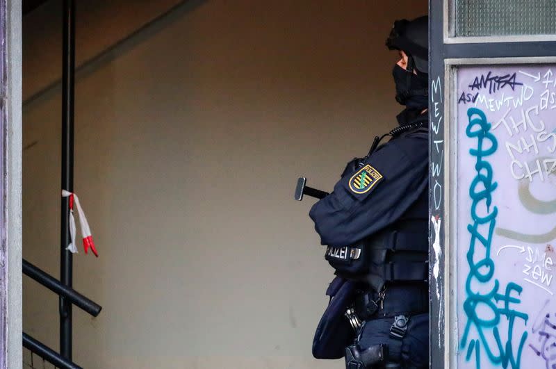 German police secure the area during raids in Berlin