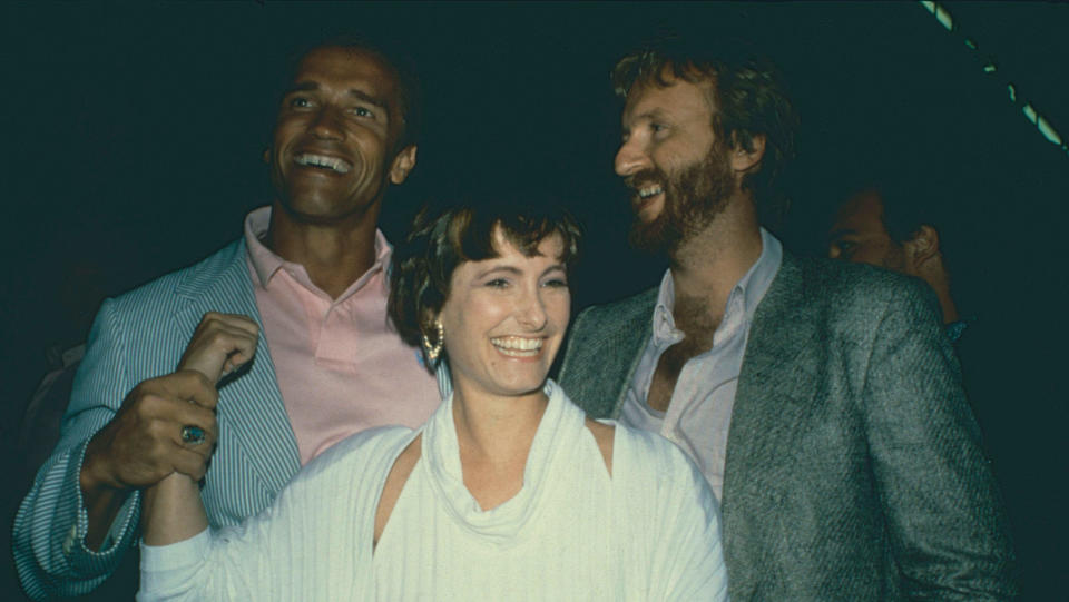 Arnold Schwarzenegger, Gale Anne Hurd, and James Cameron celebrate the release of The Terminator. (Alamy)