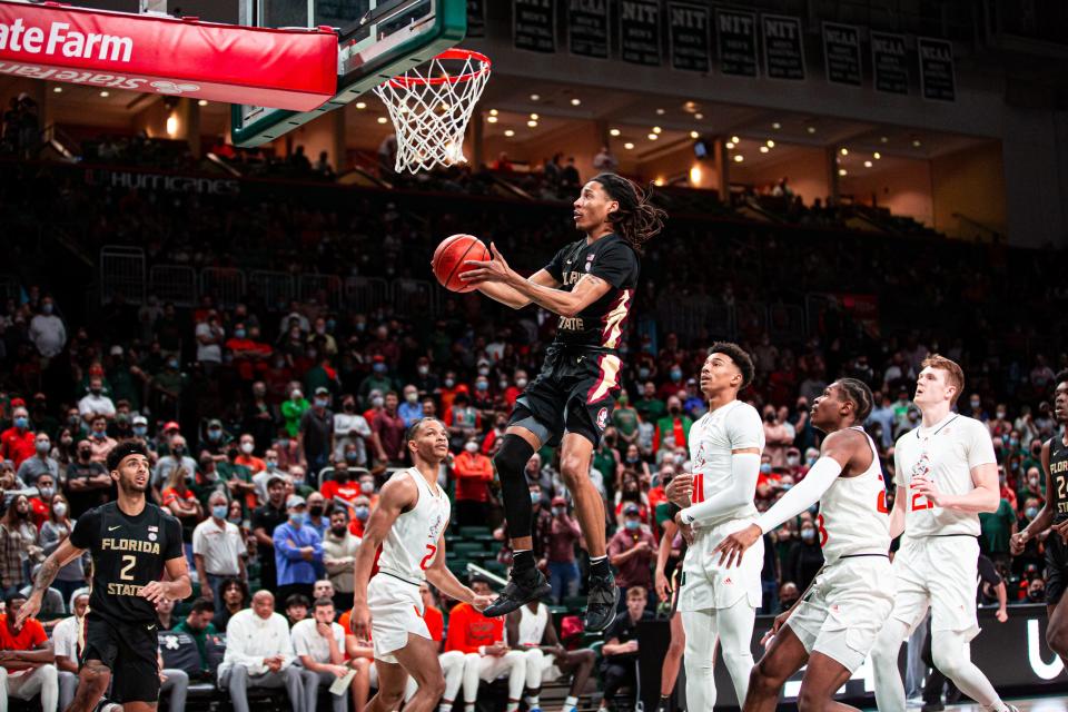 Florida State guard Caleb Mills lays in a basket as the Seminoles won their sixth straight game with a 61-60 victory at Miami on Jan. 22, 2022.