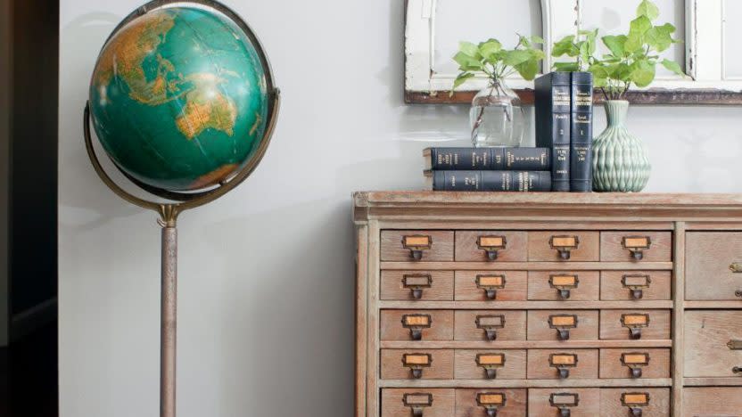 The Gaines went antiques shopping together, and Chip was very proud of himself for finding this unique globe.<p class="credit">HGTV</p>
