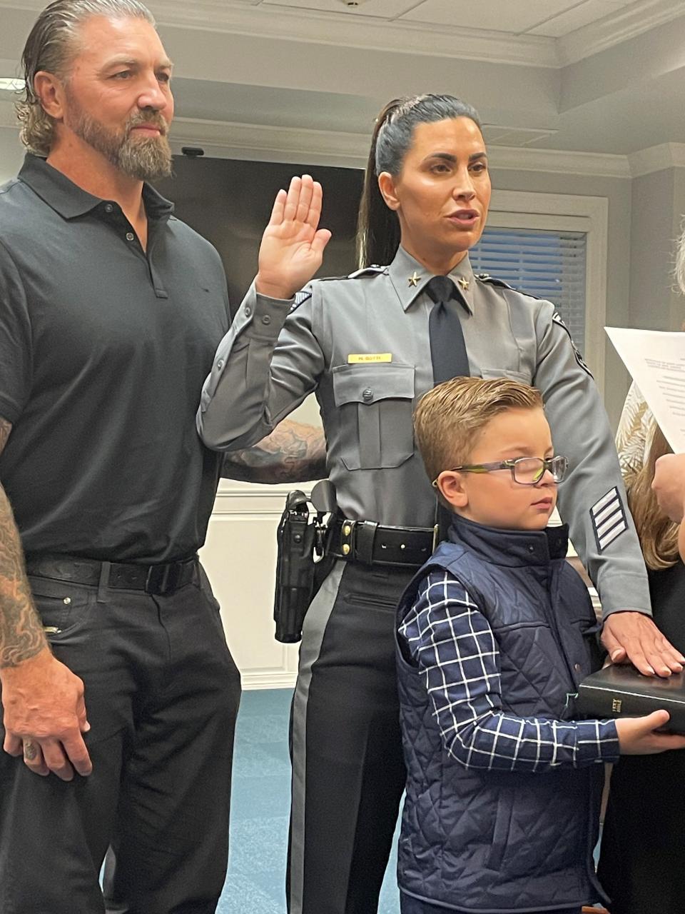 Marlowe Botti is sworn in as the new police chief at West Long Branch. Botti is the first female police chief in the borough's 115-year history. Standing next to her is her son Thomas and her husband Thomas Patten.