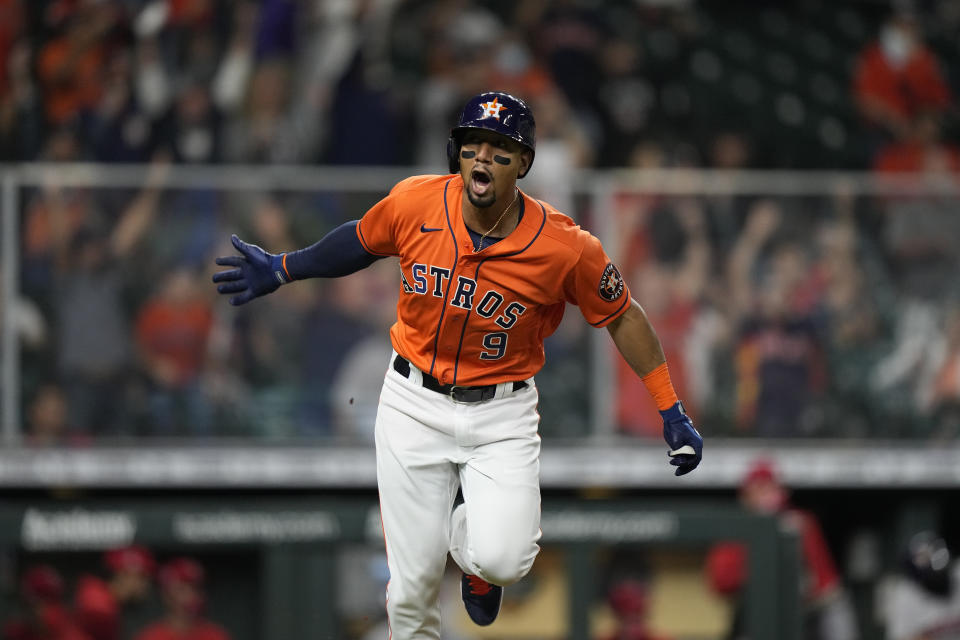 Houston Astros' Robel Garcia celebrates after hitting a game-winning single during the 10th inning of a baseball game against the Los Angeles Angels Friday, April 23, 2021, in Houston. The Astros won 5-4 in 10 innings. (AP Photo/David J. Phillip)