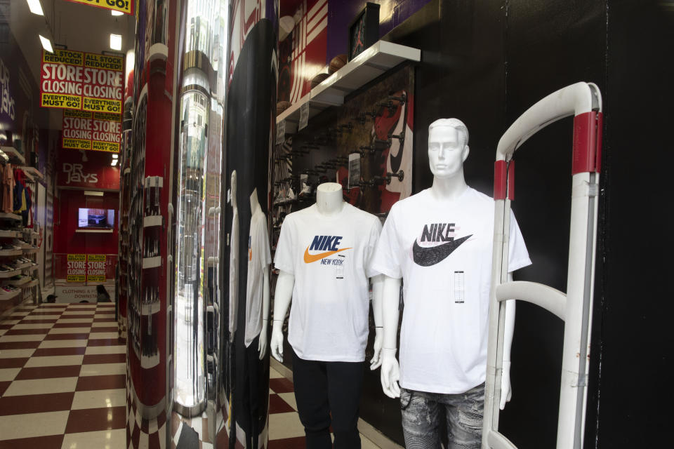 FILE - This Thursday, March 19, 2020 file photo shows Nike apparel on mannequins in a sporting goods store in the Brooklyn borough of New York. On Friday, Sept. 11, 2020, The Associated Press reported on stories circulating online incorrectly asserting Nike was quoted saying it could "afford to let go of all ‘Make America Great Again’ customers.” The quote is fake, according to company spokeswoman Sandra Carreon-John, who confirmed to the AP that the quote “definitely did not come from anyone at Nike.” (AP Photo/Mark Lennihan)