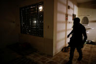 <p>A member of the Iraqi Army’s 9th Armoured Division inspects a room used as a cell for women inside a compound used as a prison by Islamic State militants in the 17 Tamuz (July 17) district, in western Mosul, Iraq, June 6, 2017. (Alkis Konstantinidis/Reuters) </p>