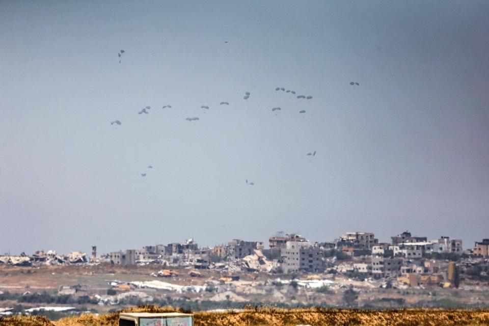 Humanitarian aid packages are dropped on the Gaza Strip (AFP via Getty Images)