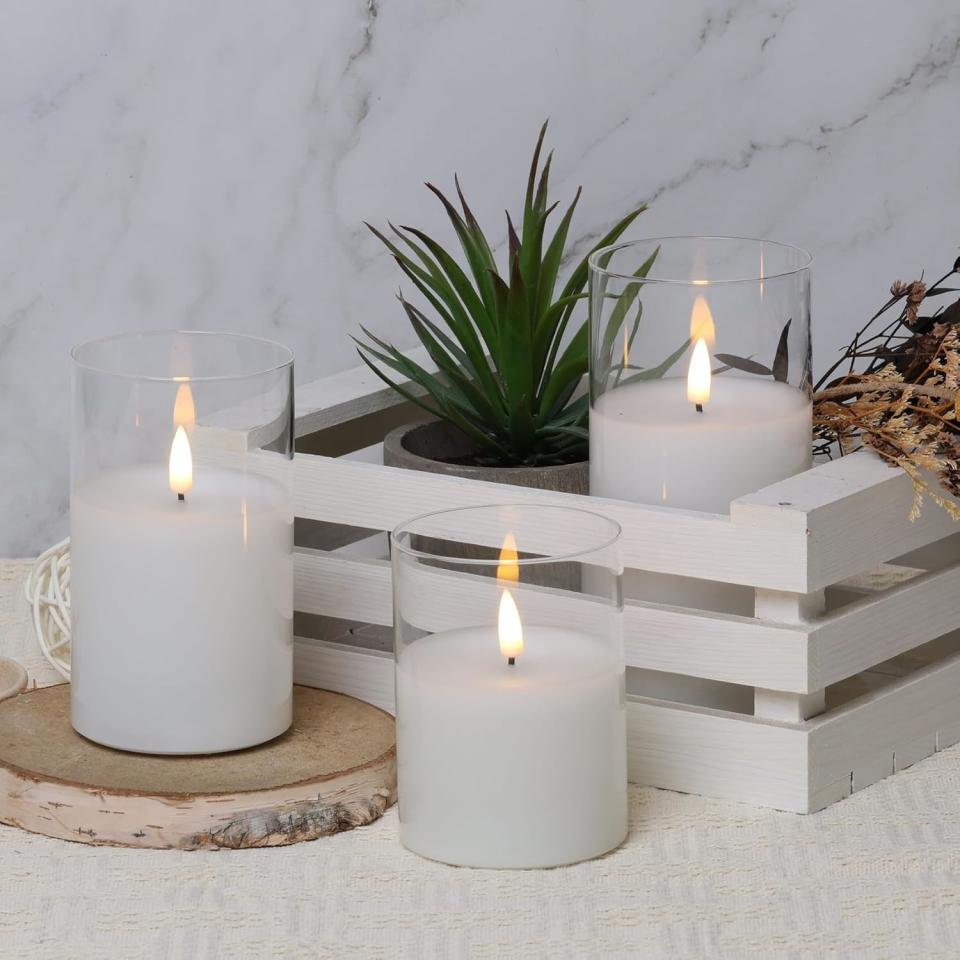 photo of Eywamage Clear Glass Flameless Candles with Remote Set of 3, White Flickering Battery Operated LED Pillar Candles