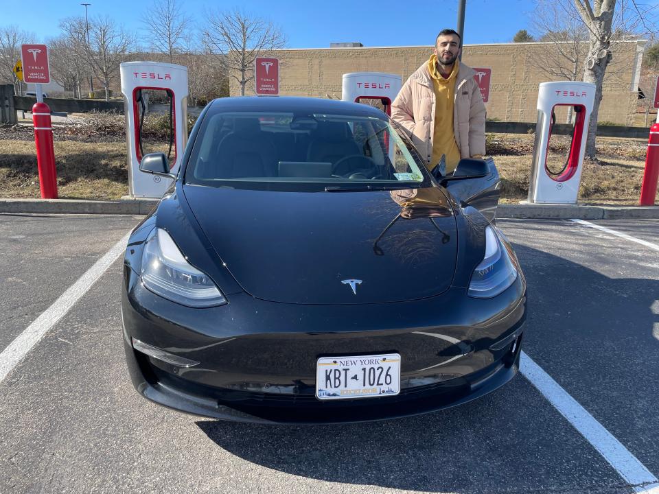 Lisbon resident Wajid Afridi drives a Tesla for work. Though it takes an hour to charge, the power costs less than what he'd spend on gas.