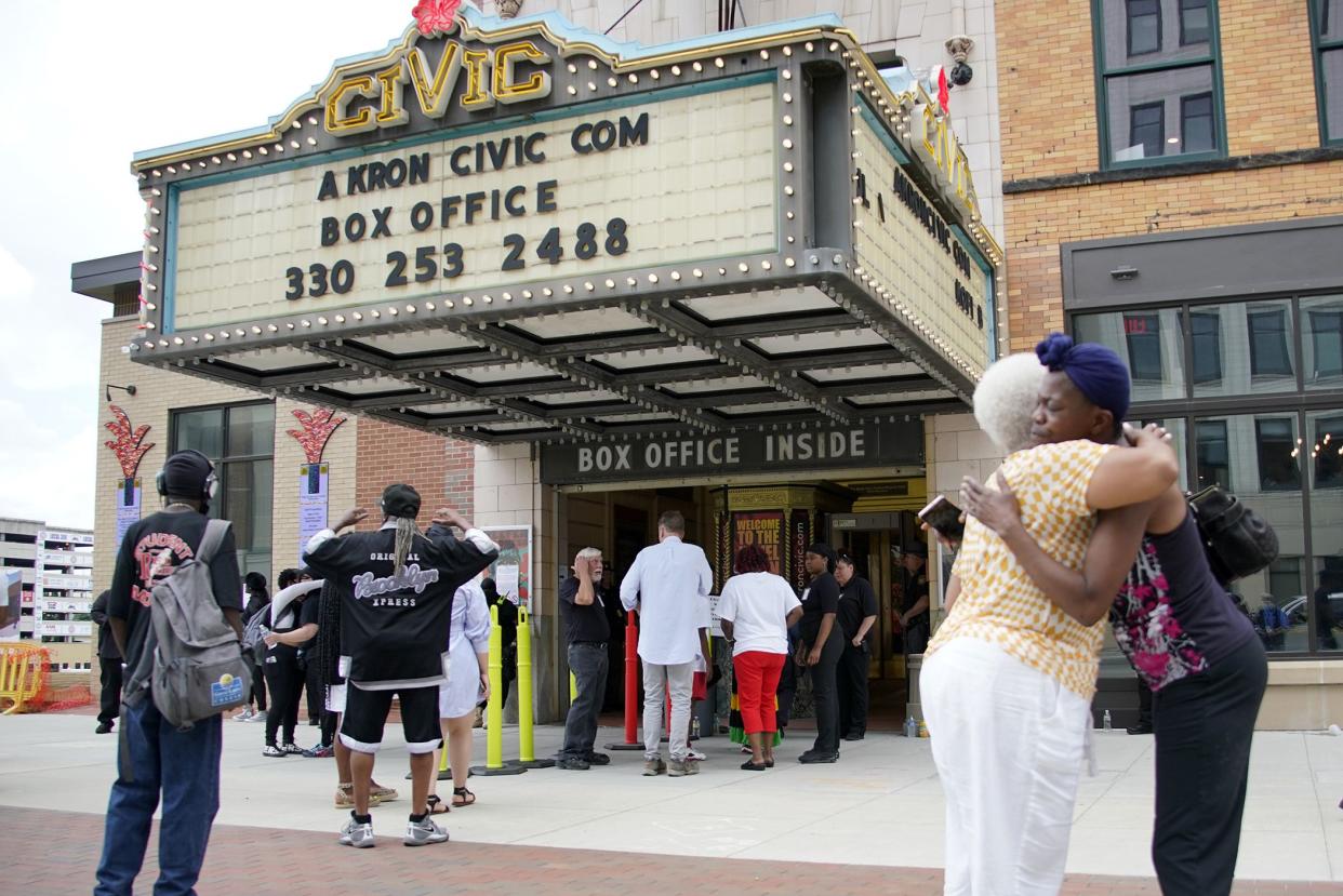 People hug outside the Akron Civic Center after attending a viewing for Jayland Walker in Akron, Ohio, Wednesday, July 13, 2022. On June 27, 2022 