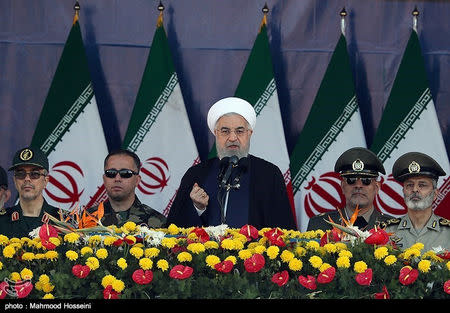 Iranian President Hassan Rouhani delivers a speech during the annual military parade marking in Tehran, Iran September 22, 2018. Tasnim News Agency/via REUTERS