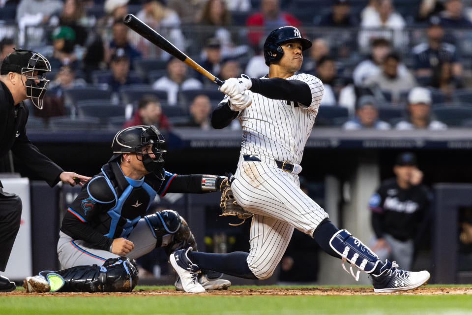 NEW YORK, NEW YORK - APRIL 08: Juan Soto #22 of the New York Yankees hits a three-run home run during the fourth inning of the game against the Miami Marlins at Yankee Stadium on April 08, 2024 in in the Bronx borough of New York City. (Photo by Dustin Satloff/Getty Images)